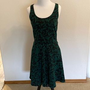 Eyelash couture, fit and flare, black and green floral dress size medium